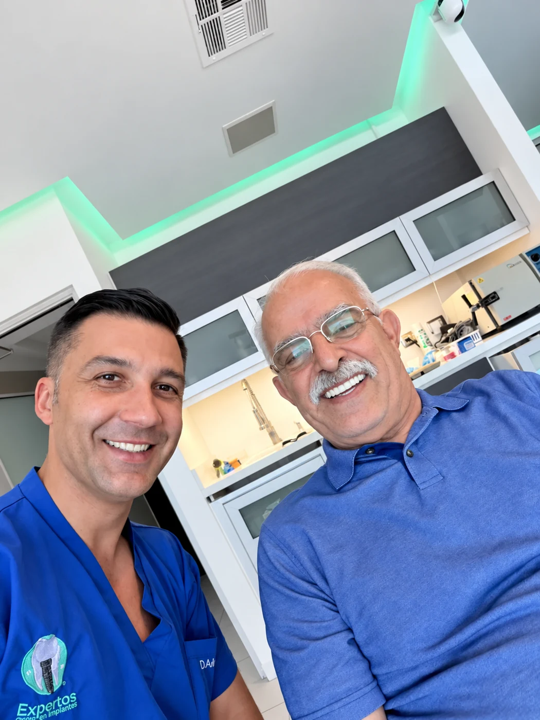 All-on-6 patient smiling with Dr. Adrian Moisa