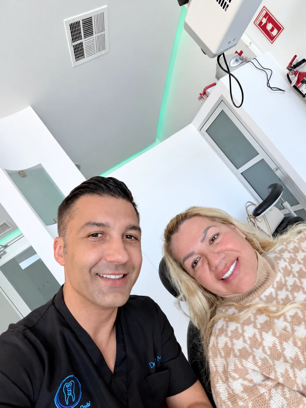 All-on-6 patient smiling with Dr. Adrian Moisa
