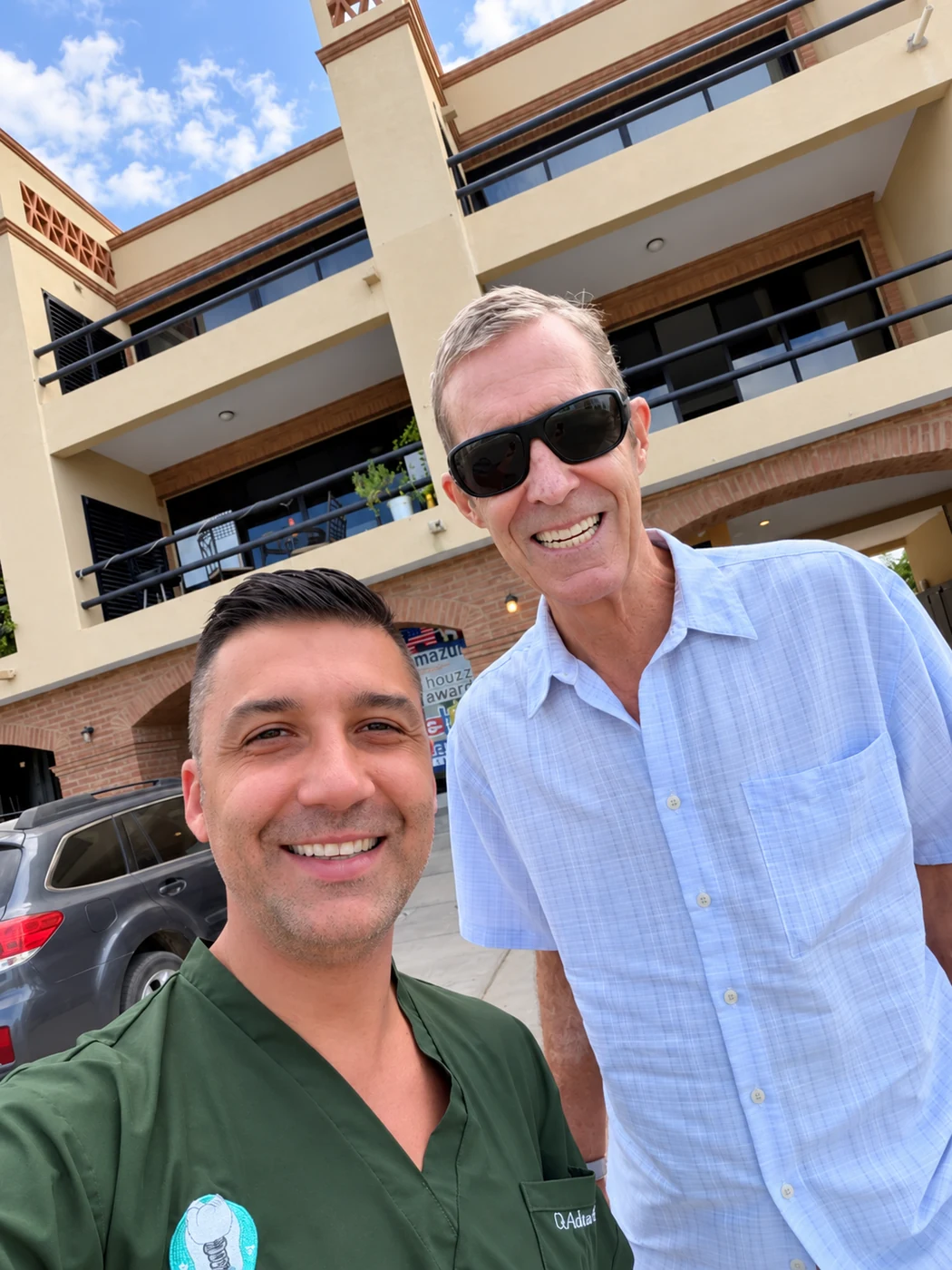 All-on-6 patient smiling with Dr. Adrian Moisa