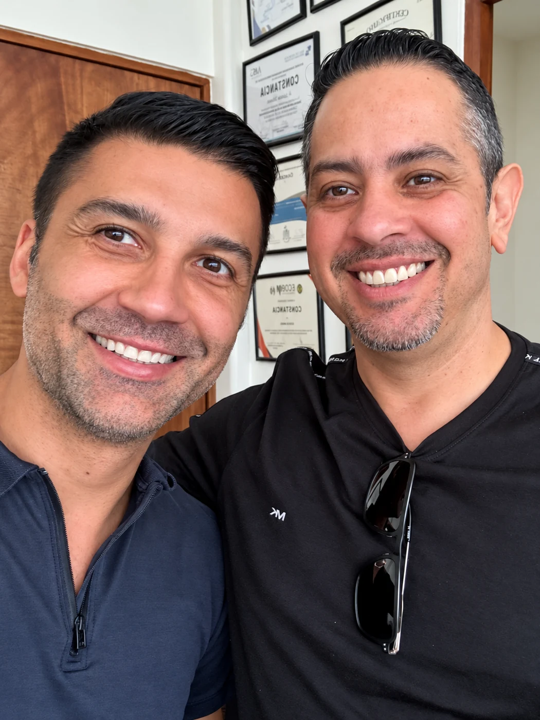 Patient smiling with Dr. Adrian Moisa at the clinic